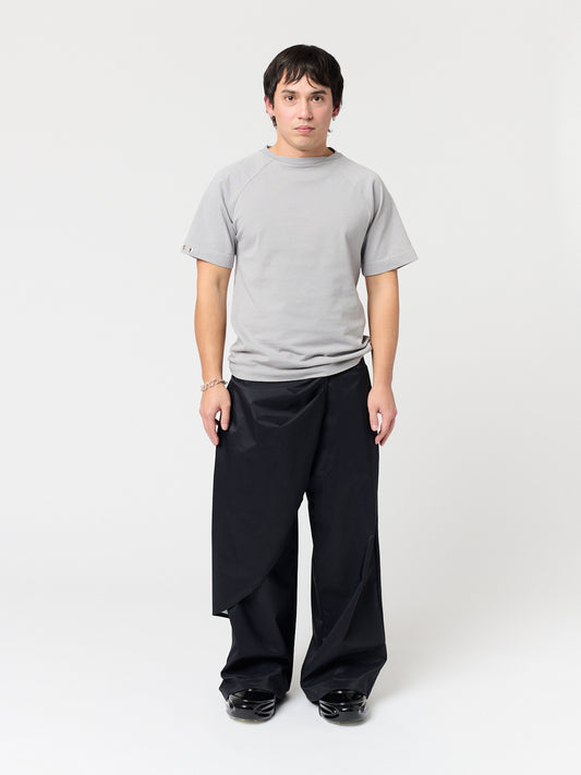 rest defense stud draped trousers in raven black