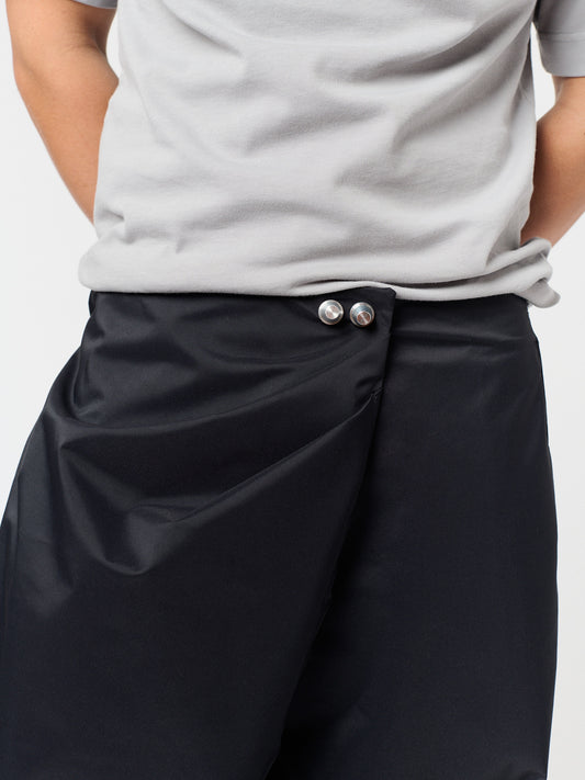 rest defense stud draped trousers in raven black